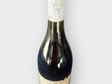 a bottle of wine that is sitting on a table