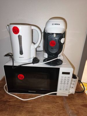a microwave and a blender sitting on top of a counter