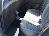 the back seats of a car with a seat belt in the back of it