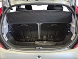 the back of a car with its trunk open and the seats folded down