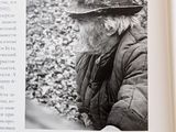 a black and white photo of a man in a hat