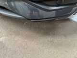a car that is parked on the side of the street