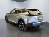 the rear end of a silver suv parked in a garage