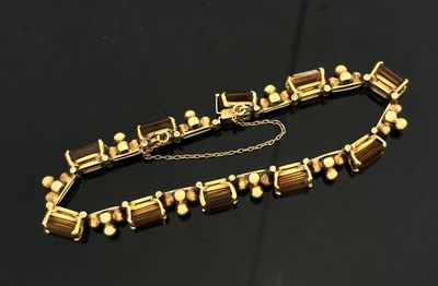 BRACELET en or jaune 750 mil. alternant pierres fines jaune taille éme - Photo 1