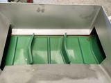 a metal box that has a green lid on it