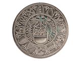 a close up of a silver coin with a coat of arms on it