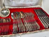 a box with silverware in it on a table