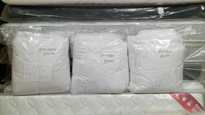 a stack of mattresses that are on display in a store