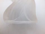 a close up picture of a person in a white dress holding a cell phone