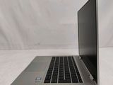a laptop computer that is sitting on a white surface