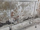 a metal rack that is on the side of a building