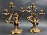 pair of antique brass candlesticks with cherenshes and flowers