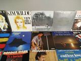 a lot of vinyl records on the table