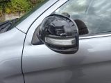 a close up of a car ' s side mirror with a dog in it