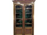 an image of a wooden bookcase with glass doors