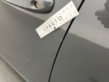 a sticker on the door handle of a car