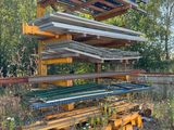 a large stack of metal and wood items in a field