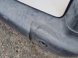 a close up of the bumper of a white car