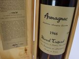 a bottle of wine that is in a wooden box