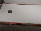 a box with a laptop on top of it in a garage