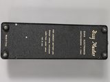 a close up of a black box on a white surface