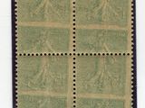 a stamp with four different images of people on it
