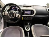 the interior of a small car with a steering wheel and dashboard