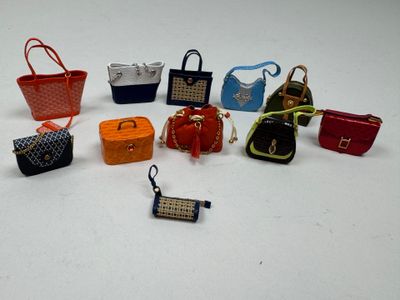 a lot of purses that are sitting on a table