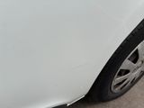 a close up of a car ' s tire with a sticker on it