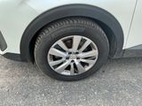 a close up of a car ' s tire on the road