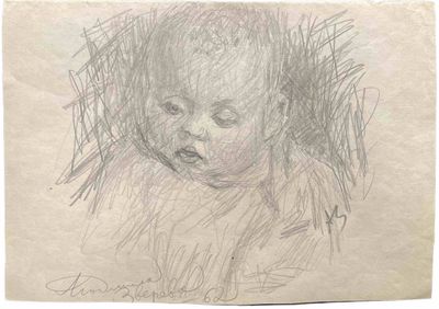 une image représentant le dessin du visage d'un bébé sur une feuille de papier