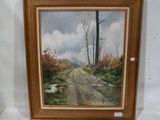framed oil painting of a country road with trees and water