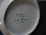 a close up of a plate with a flower on it