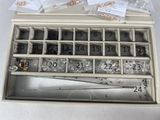 a box with a lot of beads in it