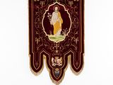a wall hanging with a picture of an angel on it