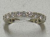 an image of a diamond ring sitting on top of a table