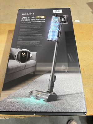 the box is open on a table with a vacuum on it
