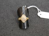 a ring that is sitting on a table with a price tag attached to it