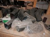 many pieces of plastic wrapped up on a table