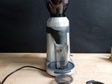 a blender that is sitting on a table next to a cup