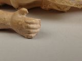 a figurine of a person laying on a table