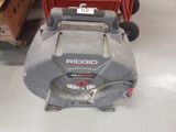a lawn mower sitting on the floor in a store