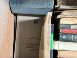 a box full of books sitting on top of a table
