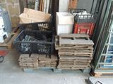 a pile of boxes and crates on a pallet in a warehouse