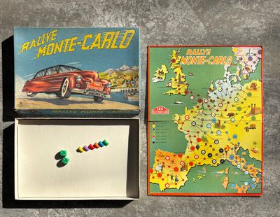a box with a game on it and a card game on the table