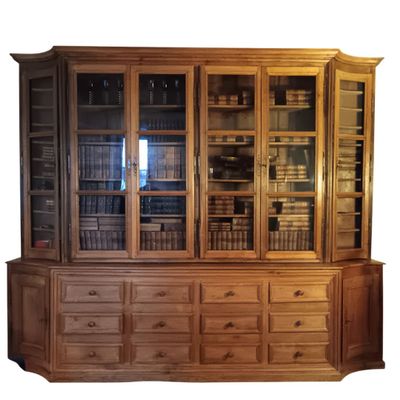 an image of a wooden bookcase with many books on it