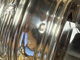 a close up of a silver object on a table