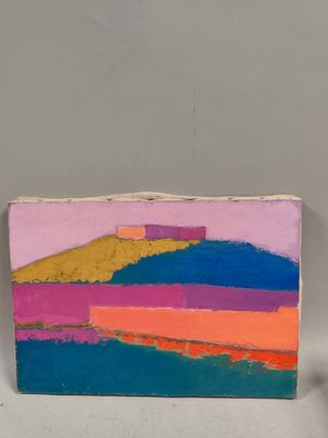 painting of a colorful landscape on a piece of wood with a candle