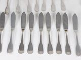 a lot of silverware on a table with forks and spoons