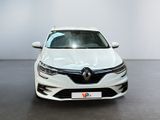 the front view of a white car parked in a showroom